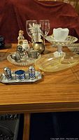 Overview of assorted entertaining serving pieces displayed on a table.
