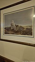 Full view of framed Snowy Owl print showing white matting and wooden frame with glass.