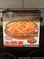 Front view of the Gotham Steel 12 inch round crisper tray packaging highlighting features.