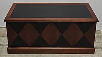 Front view of Lane cedar chest showing diamond checkerboard pattern in black and wood tones.