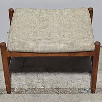 Front view of stool showing full cushion and frame