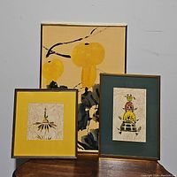 Three framed modern art pieces arranged together showing distinct styles and sizes