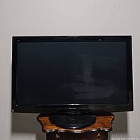 Front view of the Panasonic 46-inch plasma TV showing the screen, frame, and part of the stand.