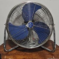 Front view of vintage Patton fan showing chrome grill and blue blades