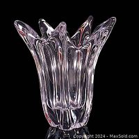 Full front view of clear lead crystal splash vase showing fluid organic splash form with pointed extensions and wide opening.