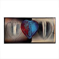 Front view of resin artwork showing three heart shapes including central colored heart and two clear heart impressions.