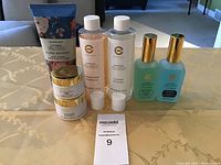 Photo showing entire set: tubes, jars, and bottles arranged on a table with tags.