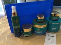 Full view of all Elizabeth Grant Modern Defense skincare products and plastic container.