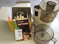 Philips FP5708 food processor with motor unit, plastic large processing bowl and lid, original box containing multiple attachments and manuals.