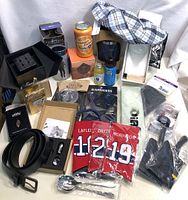 Overview image showing men’s boxer shorts, jerseys, colognes, belts, ties, gloves, spoons, suspenders and drinkware.