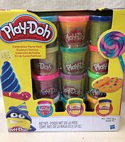 Photo of new Play-Doh Celebration Party Pack with 12 cans of various colored modeling compound in original packaging.