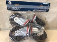 Packaged set of four 3 inch rubber casters, two with side brakes, new in bag.