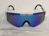 Front view of sunglasses showing large mirrored blue lens with Viper logos on each side.