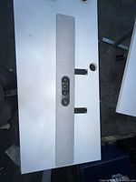 Full view of the Cisco quad camera unit mounted on a white surface illustrating the entire rectangular, textured panel and mounting brackets.