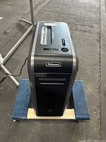 Full front and top view of the Fellowes Powershred 125Ci shredder showing paper entry and control panel, revealing its model and brand.
