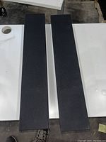 Both speakers with fabric grilles installed