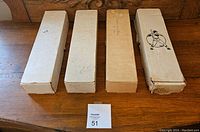 Four cardboard storage boxes of baseball cards from the 1980s and 1990s, showing their condition and labels.