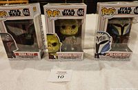 Three boxed Star Wars Funko Pop figures: Boba Fett 462, Gamorrean Fighter 406, Bo-Katan Kryze 463 displayed.