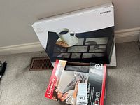 Sunbeam heated throw and Bowring photo tray in their respective boxes