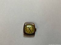 Front view of entire watch head showing case and dial