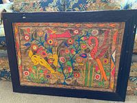 Frontal view of entire framed bark painting showing composition of birds and flowers