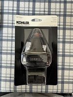 Single Kohler pressure balancing faucet cartridge sealed in packaging with visible model GP76851 on label.