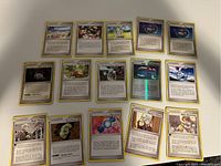 Top view of 15 Pokemon Trainer cards from 2005-2008 laid out showing front of cards with various game text and artwork.