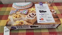 Photo of the Wilton baking set box showing variety of items included and product branding