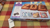 Box of Wilton Countless Celebrations Cake Pan Set with image of letter-shaped cakes spelling 'ZOE'