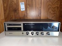 Front view of Bradford 8-track stereo unit showing front panel with 8-track slot, control knobs, and brand label.