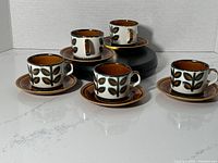 Five Boch Rambouillet coffee or espresso cups with matching saucers displayed on a white surface.