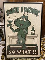 Full image of vintage cartoon frog drinking comic art in a black frame