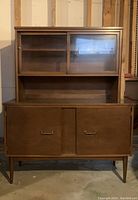 Full view of walnut credenza with hutch, showing overall design and condition