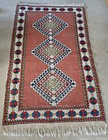 Overall top-down view showing full pattern, color field and fringed edges