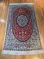 Full top-down view of rug showing entire design and fringes