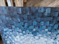 Full view of the abstract textured acrylic painting showing color gradient from dark blues and greys to white and light blues.