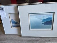 Two Peter MarkGraf artworks in silver metal frames, viewed from front and side angles showing frame and matting details.