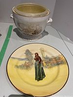 Spode ice bucket and Royal Dalton plate displayed together