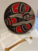 Front view of drum showing full eagle motif painted in red and black on natural hide