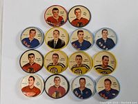 Top-down view of the 14 vintage hockey coins arranged in a grid, showing player portraits and team colors.