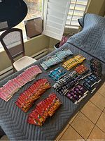 View of assorted sealed trading card packs laid out on a padded surface showing multiple different franchises and pack designs