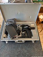 Full case view with Kowa SL handheld slit lamp and control box inside custom foam case