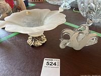 Photo showing two Murano glass items: frosted glass bowl on brass base and clear abstract glass sculpture.