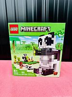 Front view of the factory sealed LEGO Minecraft 21245 The Panda Haven box showing main assembled panda figure and set information.