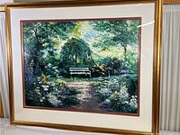 Front view of the framed colorful garden scene print showing the overall artwork and frame details
