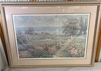 Framed landscape print showing entire artwork and frame with matting.