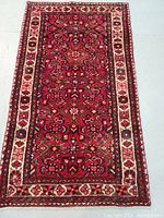 Rug laid flat showing full front design and border