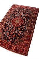 Full view of rug showing central medallion and border patterns