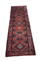Full view of the Persian Hamadan runner rug showing the entire length with nine diamond medallions and red geometric pattern