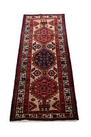 Full view of the Persian Sarab runner rug laid flat, showing entire design with three central medallions and patterned borders in cream, red, blue, and beige colors.